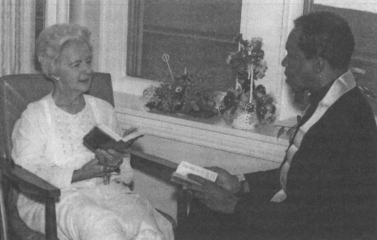 In this 1979 file photo, longtime Cathedral of St. Joseph parishioner Marie Poetker, now deceased, shares a moment of prayer after receiving Holy Communion from Dominican Father Paschal Salisbury at the old St. Mary's Health Center in Jefferson City. Fr. Salisbury, the Dominican Order’s first African American priest, served as chaplain at the hospital from 1979-84, and is now retired in Portland, Oregon.